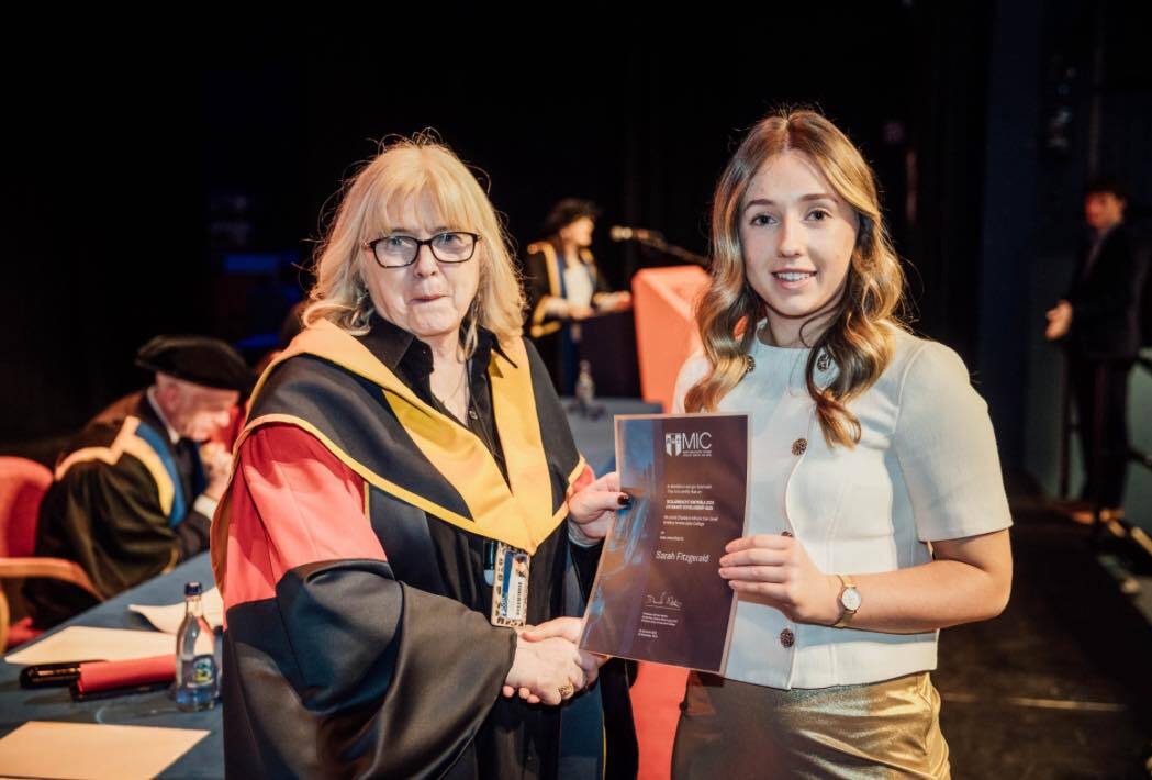 Sarah Fitzgerald receiving her entrance scholarship award